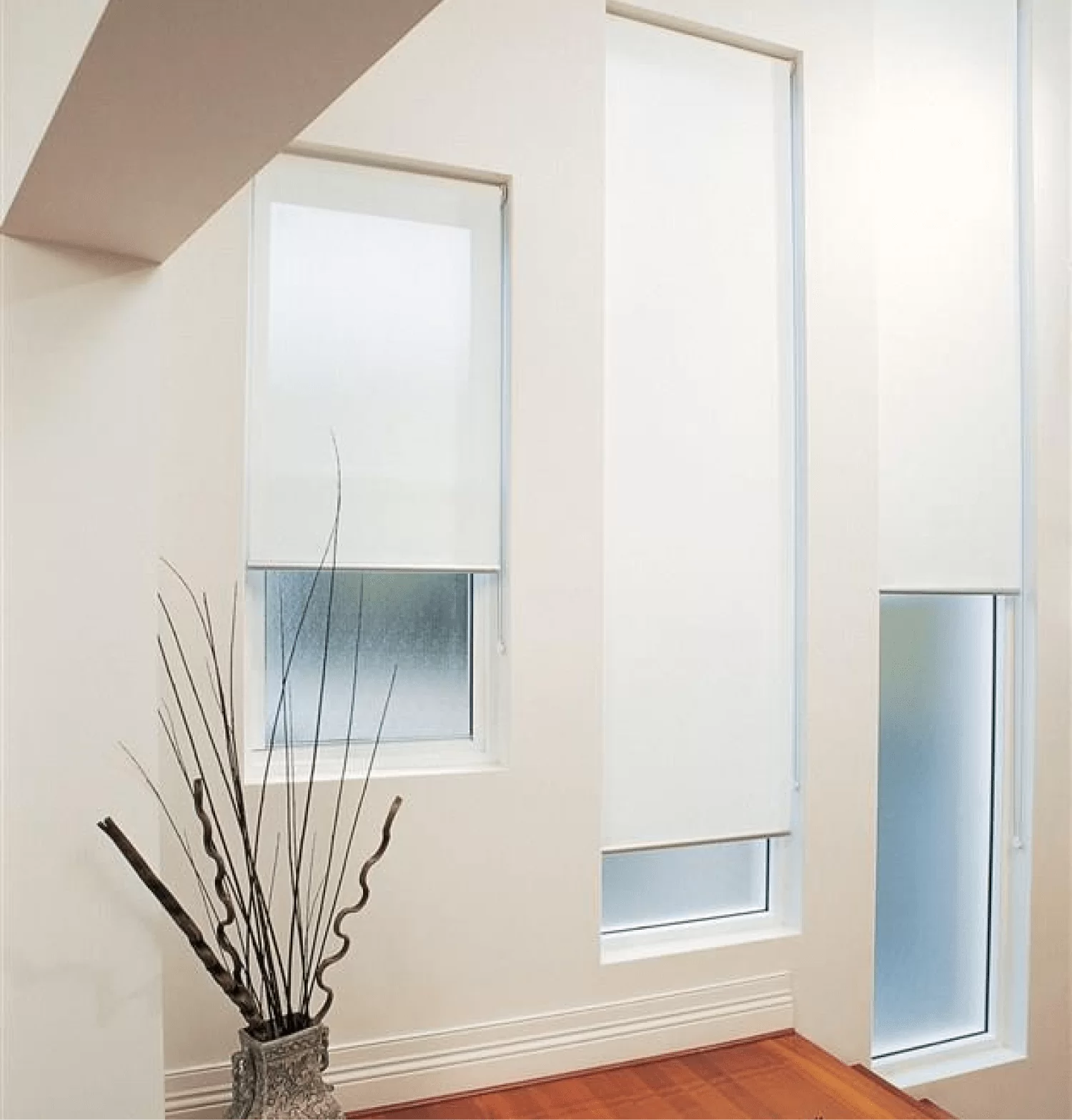 Roller Blinds Adelaide | Translucent Roller Window Blinds & Motorisation Translucent roller blinds Adelaide covering multiple windows, offering soft light and privacy with modern window furnishings.